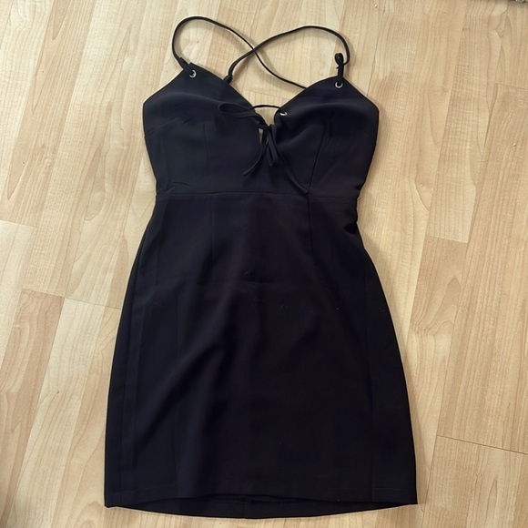 Urban Outfitters Dresses & Skirts - NWOT Urban Outfitters XS Black Mini Dress with Tie front Grommet Detail